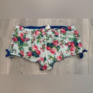Charlotte Russe Lounge PJ Shorts. Blue w/Pink floral w/side ruched ties. Size L.